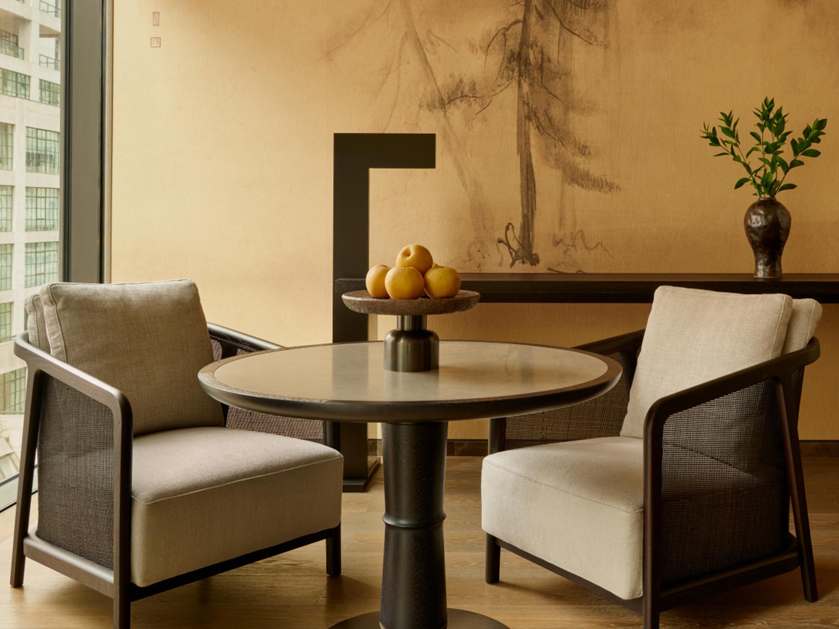 Aman Hotel Bedroom Lounge Area with Upholstered Daybed and Accent Seating